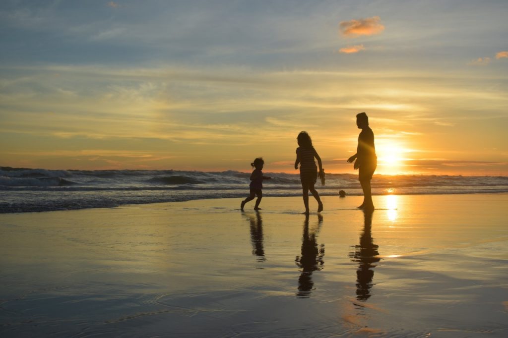 Family on the Beach at Sunset | Suzanne Polino REALTOR