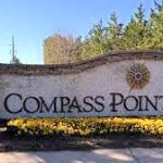 Main gated, guarded entrance to Compass Pointe